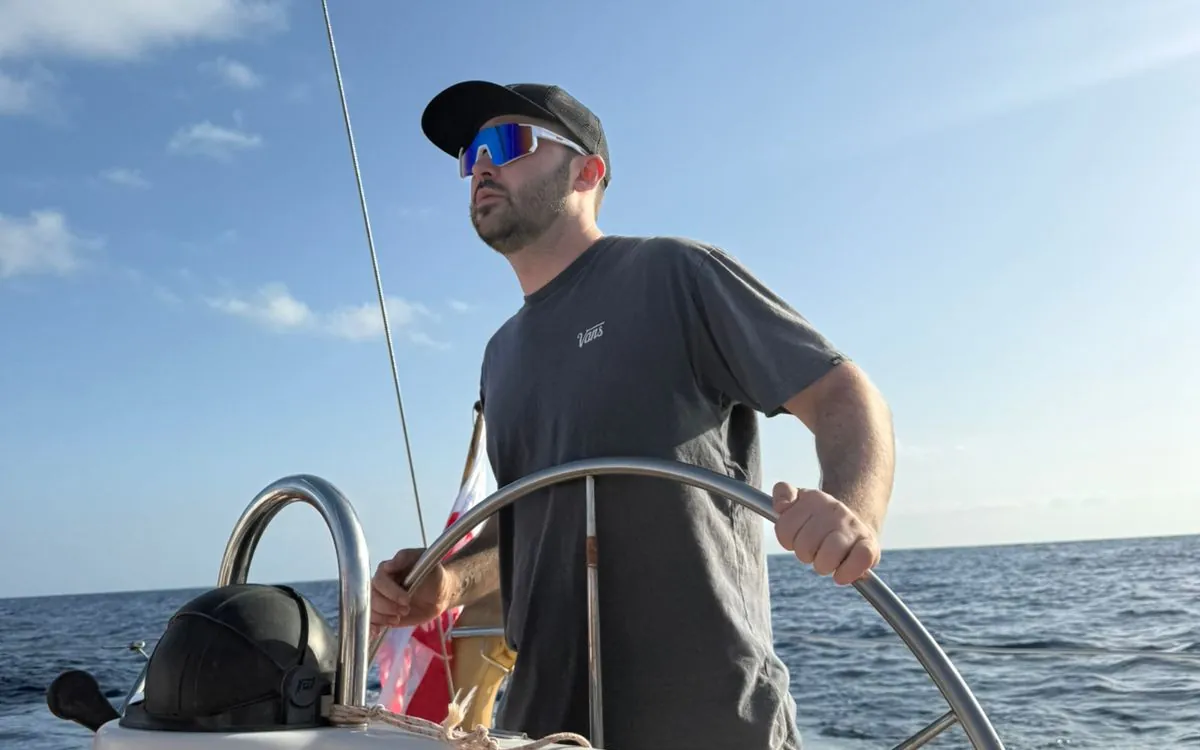 Student at the helm on the open Atlantic